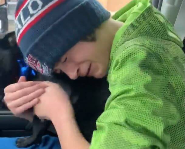 Boy reunites with his pug dog.
